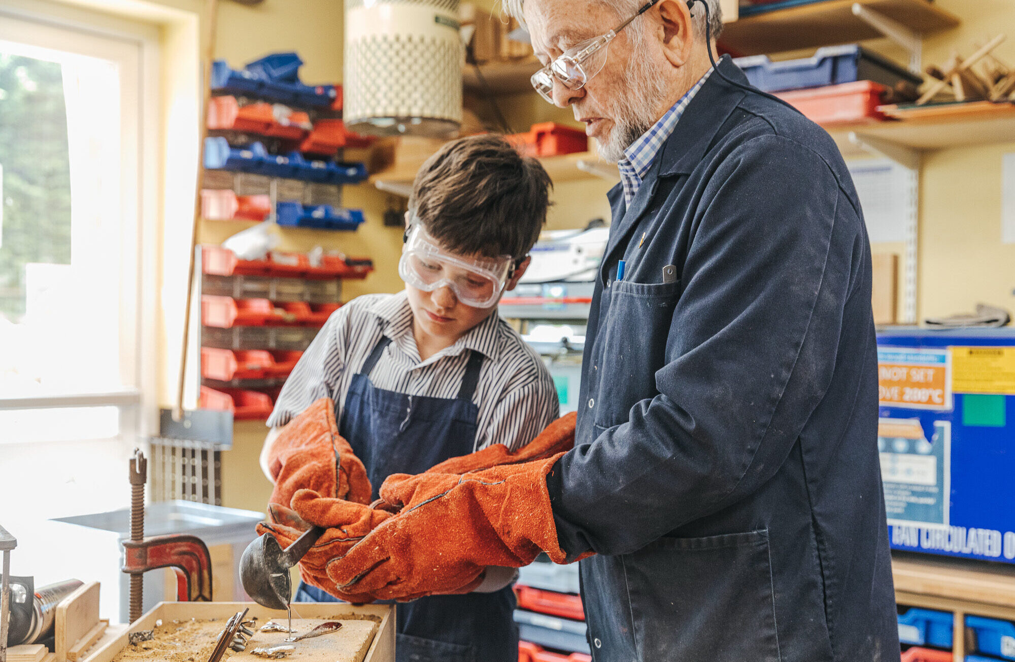 Boy melting metal in DT